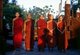 Burma / Myanmar: A group of monks at sunset in the all teak monastery of Shwe In Bin Kyaung, Mandalay