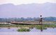 Burma / Myanmar: An Intha leg-rower in his boat on Inle Lake, in Shan State
